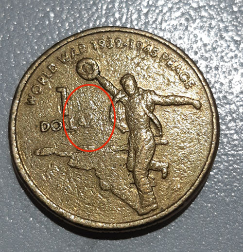 2005 $1 Australian World War Peace coin-Struck through oil.